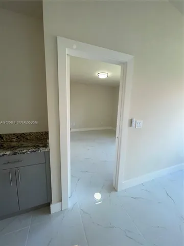 an empty room with wooden floor