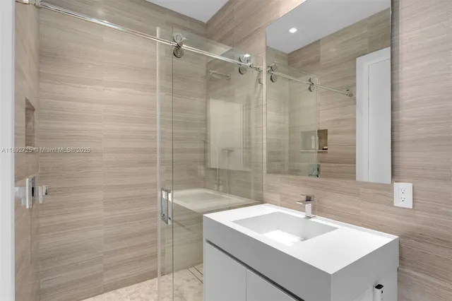 a bedroom with a bed and glass window