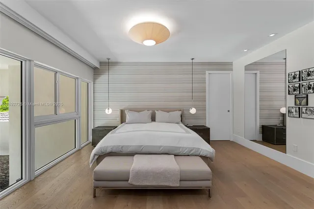 a bathroom with a shower and a sink