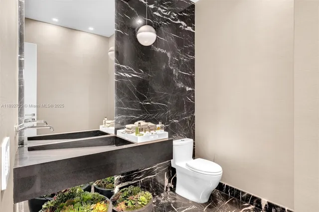 a view of backyard with swimming pool and seating space