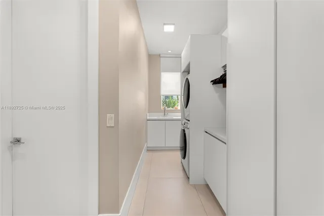 a front view of a house with a garden and yard