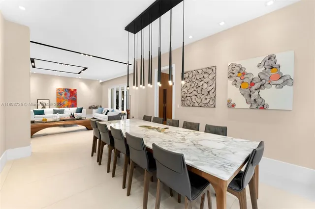 a dinning table and chairs in a room