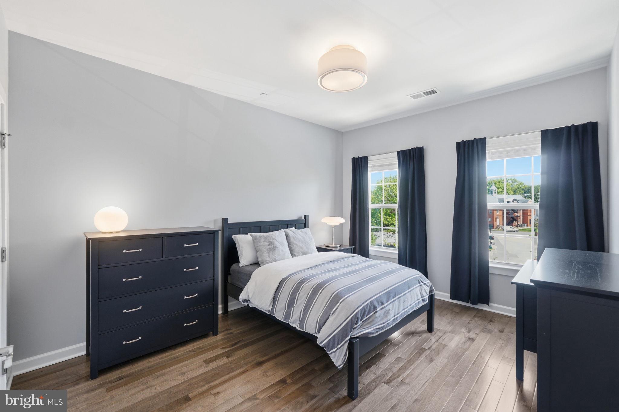 17812 Thomas Village Lane Sandy Spring, MD 20860 - Photo 24 of 37 a bedroom with a bed and a window