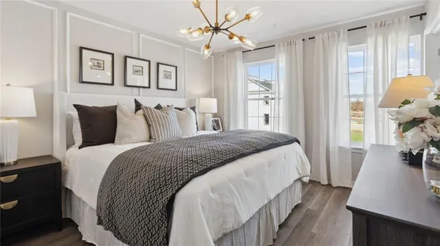 a bedroom with bed and a window