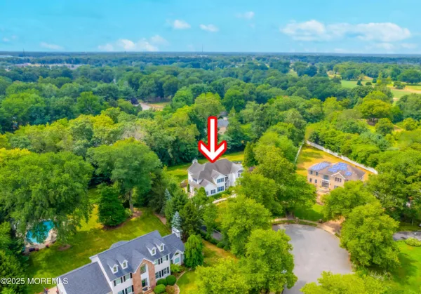 aerial view of a house with a yard