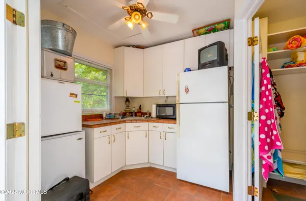 a view of a patio with a table and chairs and couches