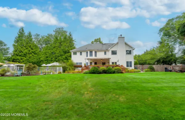 a view of a house with a chairs in patio
