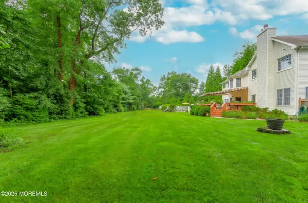 an outdoor space with swimming pool and furniture