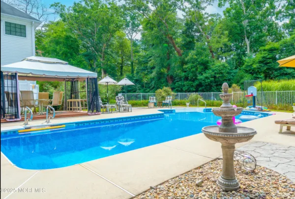 a bedroom with two beds and a chandelier