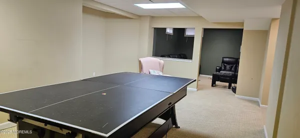 a bedroom with two beds and a chandelier