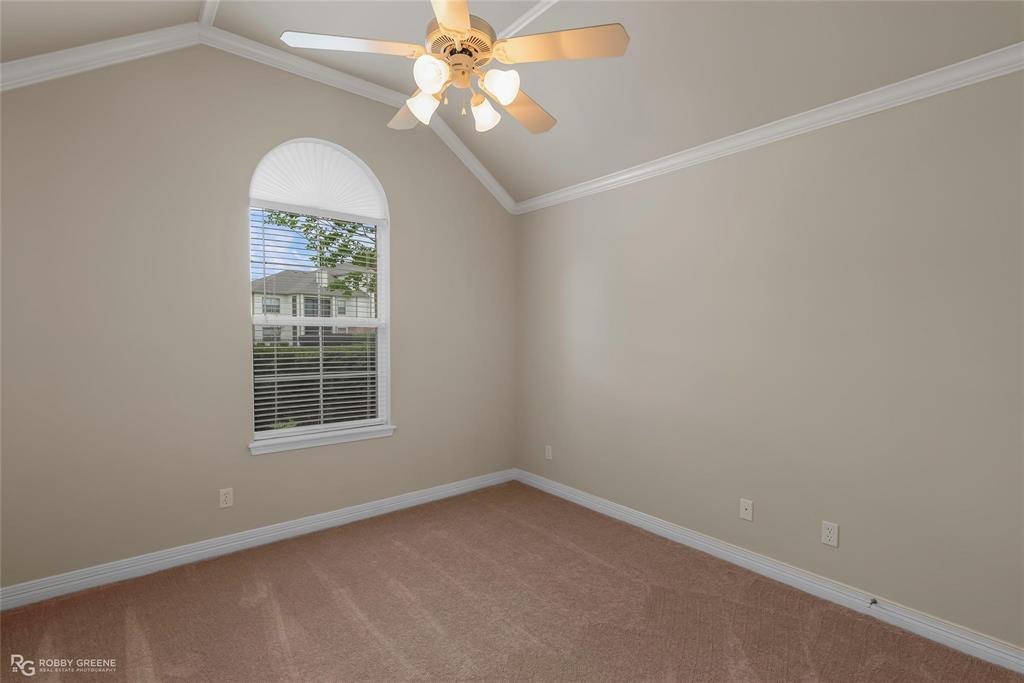 2186 Stockwell Road Bossier City, LA 71111 - Photo 19 of 40 Spare room featuring crown molding, vaulted ceiling, light colored carpet, and ceiling fan