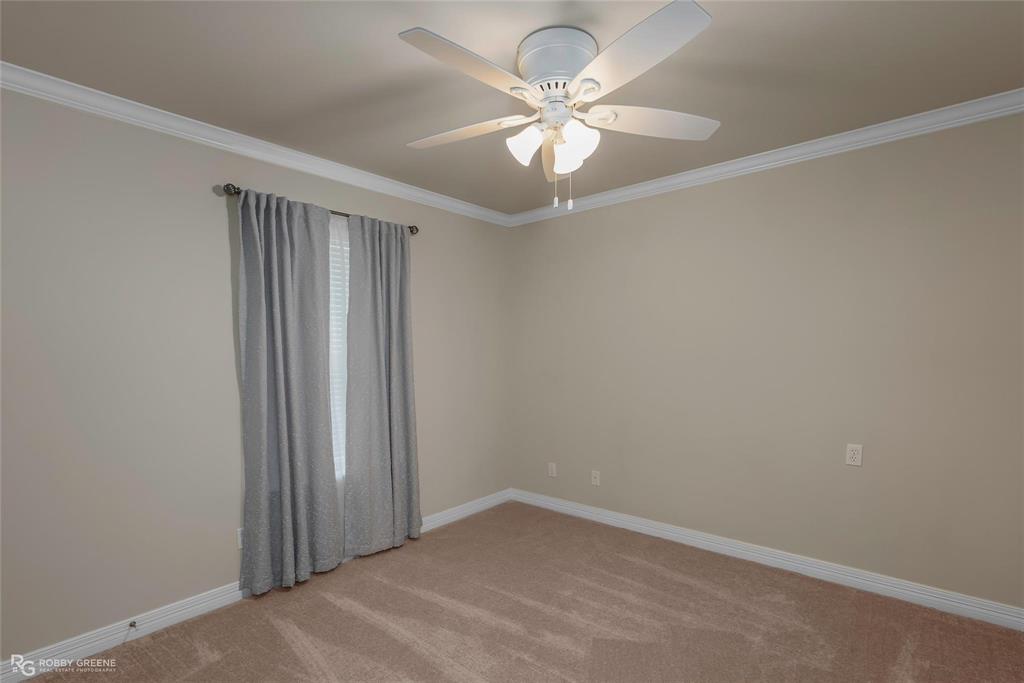 2186 Stockwell Road Bossier City, LA 71111 - Photo 21 of 40 Unfurnished room with ornamental molding, ceiling fan, and light carpet
