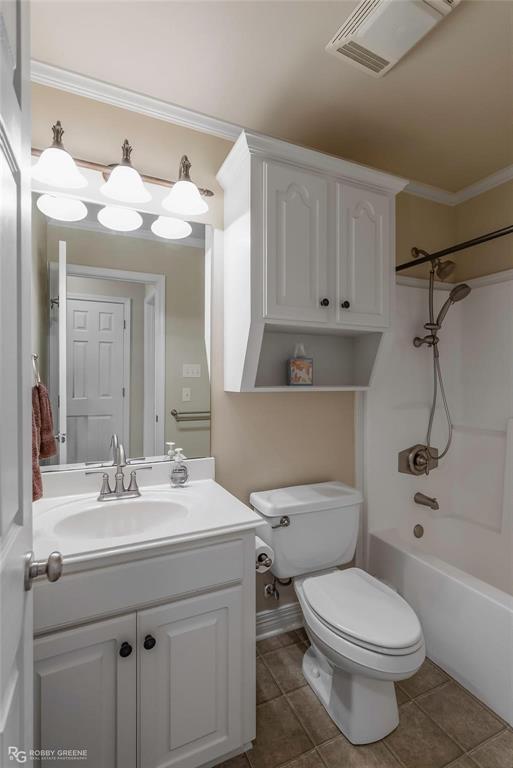 2186 Stockwell Road Bossier City, LA 71111 - Photo 22 of 40 Full bathroom with ornamental molding, vanity, washtub / shower combination, and light tile patterned flooring
