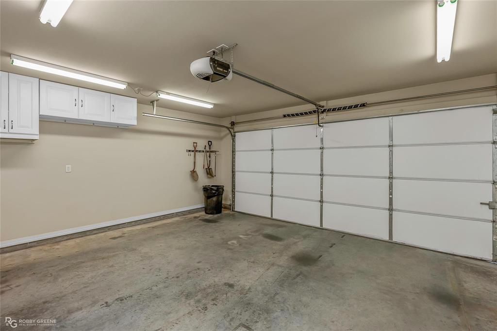 2186 Stockwell Road Bossier City, LA 71111 - Photo 24 of 40 Garage featuring a garage door opener and baseboards