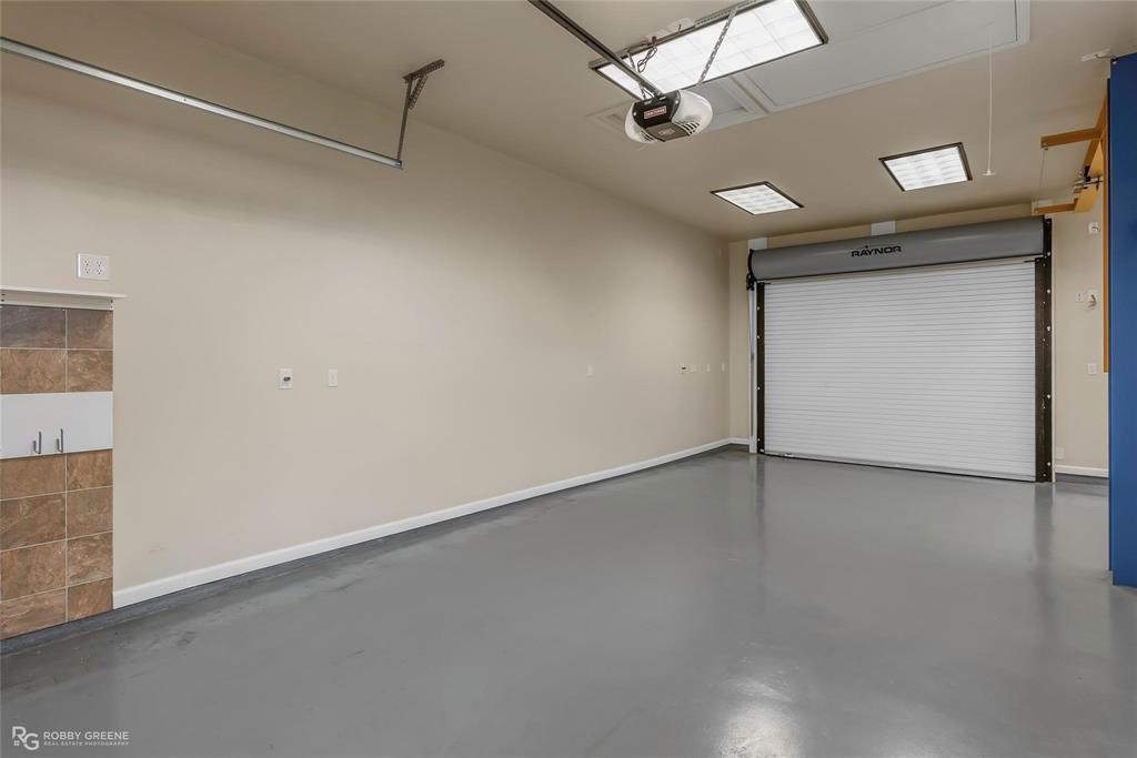 2186 Stockwell Road Bossier City, LA 71111 - Photo 26 of 40 Garage with baseboards and a garage door opener