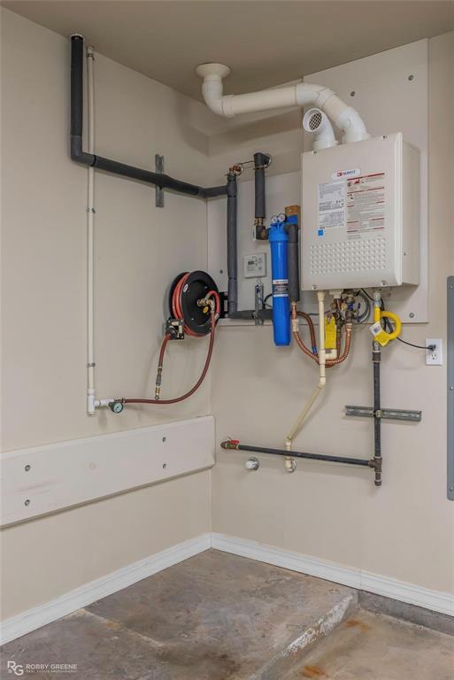 2186 Stockwell Road Bossier City, LA 71111 - Photo 27 of 40 Utility room featuring tankless water heater