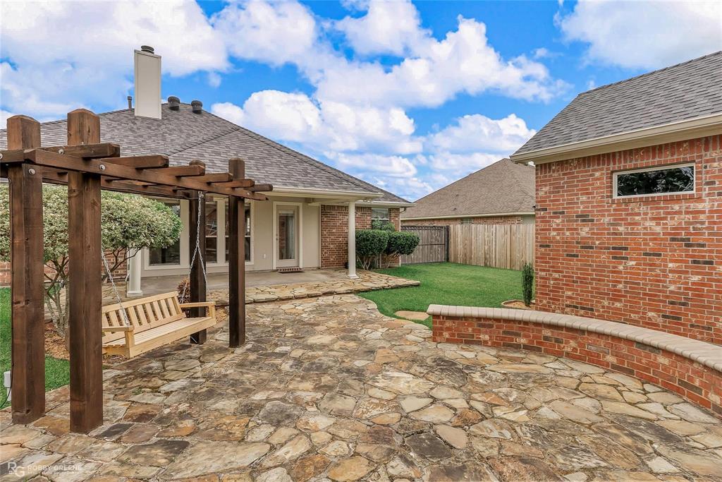 2186 Stockwell Road Bossier City, LA 71111 - Photo 32 of 40 Fenced backyard with a pergola and a patio area