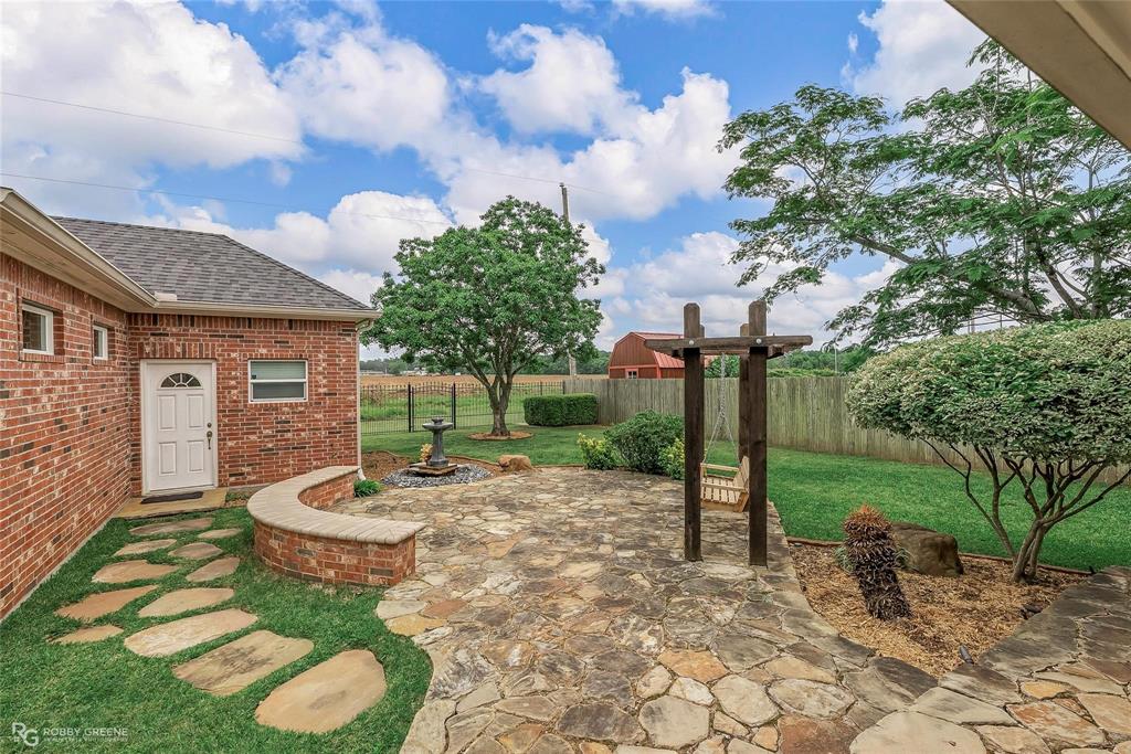 2186 Stockwell Road Bossier City, LA 71111 - Photo 34 of 40 Fenced backyard with a patio