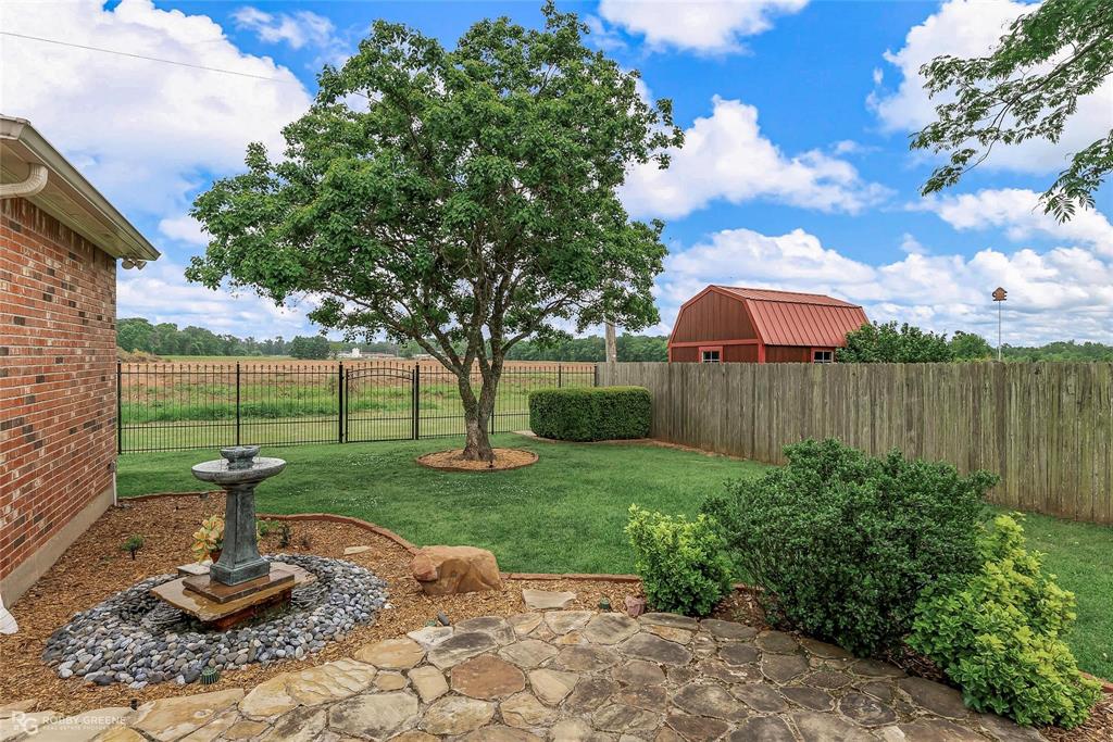 2186 Stockwell Road Bossier City, LA 71111 - Photo 36 of 40 Fenced backyard with a patio area