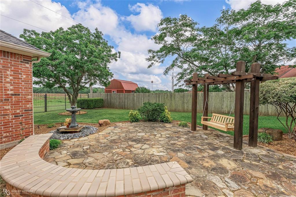 2186 Stockwell Road Bossier City, LA 71111 - Photo 38 of 40 Fenced backyard with a patio and a pergola