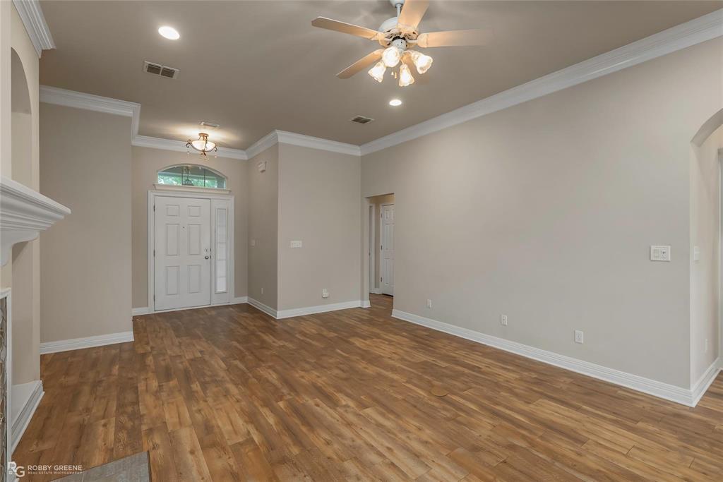 2186 Stockwell Road Bossier City, LA 71111 - Photo 6 of 40 Entryway with recessed lighting, crown molding, ceiling fan, arched walkways, and dark wood-style floors