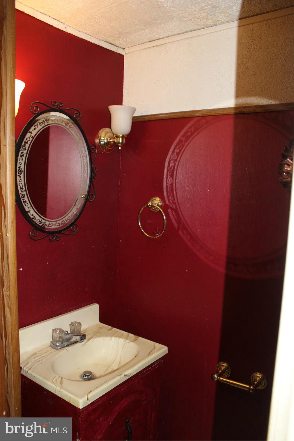 2 Rothamel Court Baltimore, MD 21236 - Photo 22 of 22 a bathroom with a sink and a mirror
