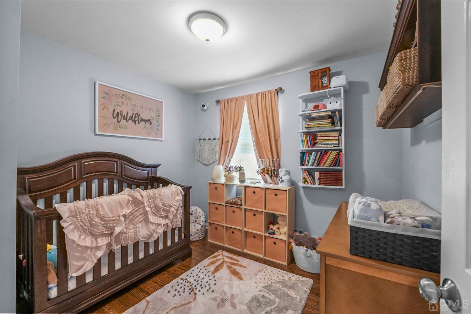 1067 Riverton Street North Brunswick, NJ 08902 - Photo 12 of 45 a bedroom with furniture and a book shelf