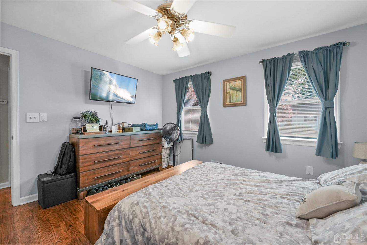 1067 Riverton Street North Brunswick, NJ 08902 - Photo 15 of 45 a bedroom with a bed and a dresser