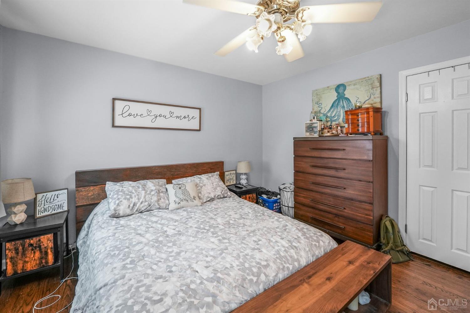 1067 Riverton Street North Brunswick, NJ 08902 - Photo 16 of 45 a bedroom with a bed and wooden floor