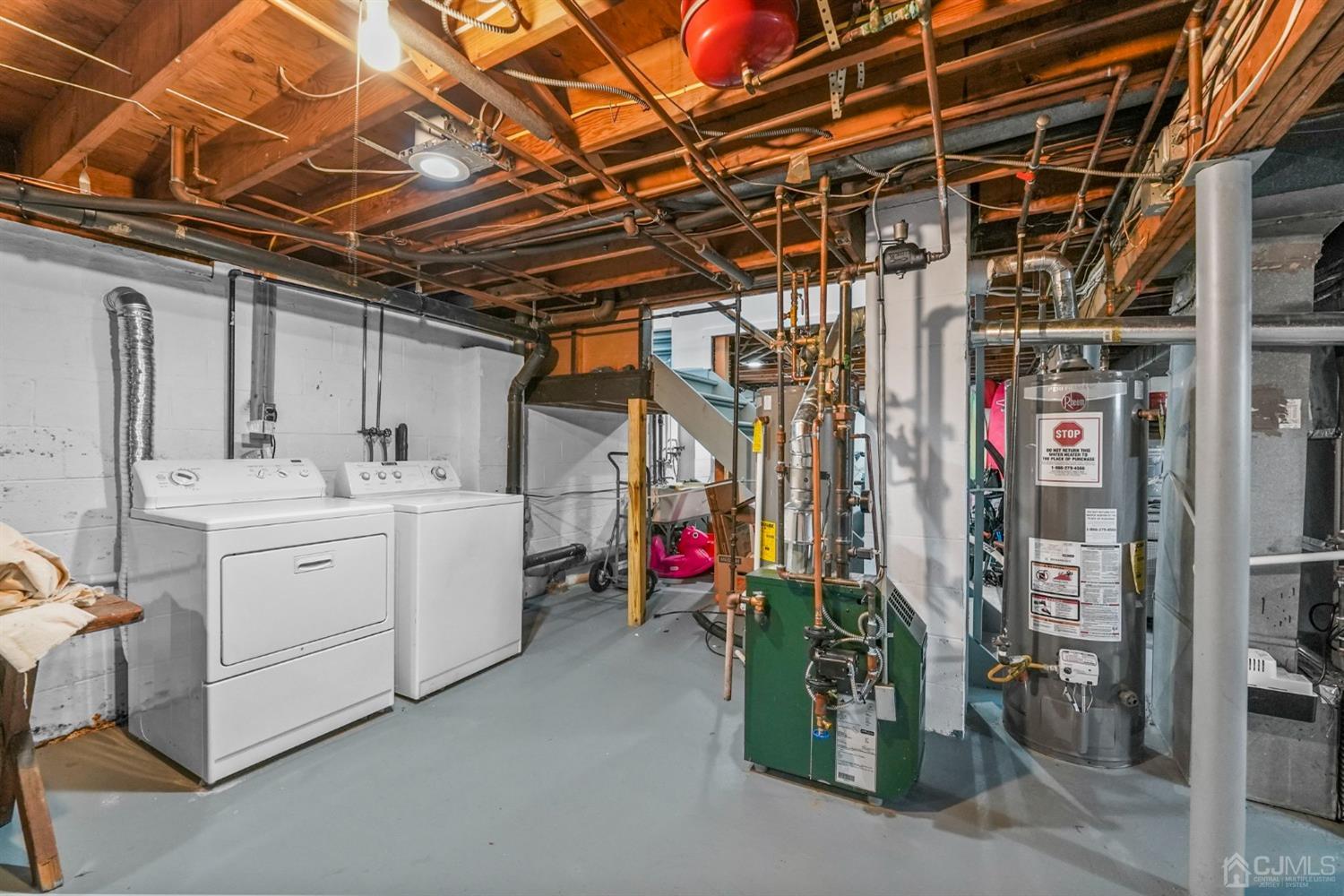 1067 Riverton Street North Brunswick, NJ 08902 - Photo 19 of 45 a utility room with dryer and washer