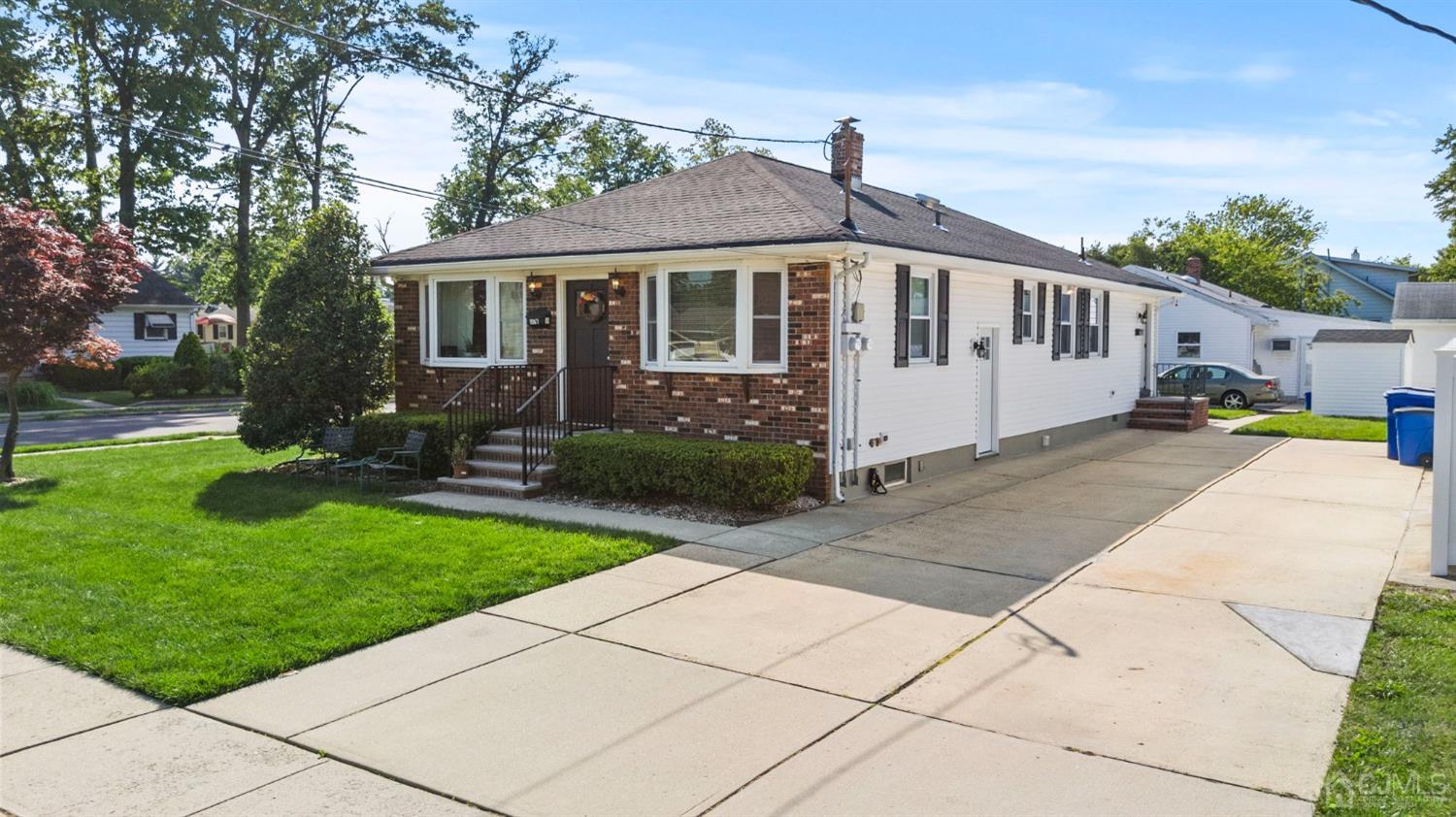 1067 Riverton Street North Brunswick, NJ 08902 - Photo 2 of 45 a front view of a house with garden