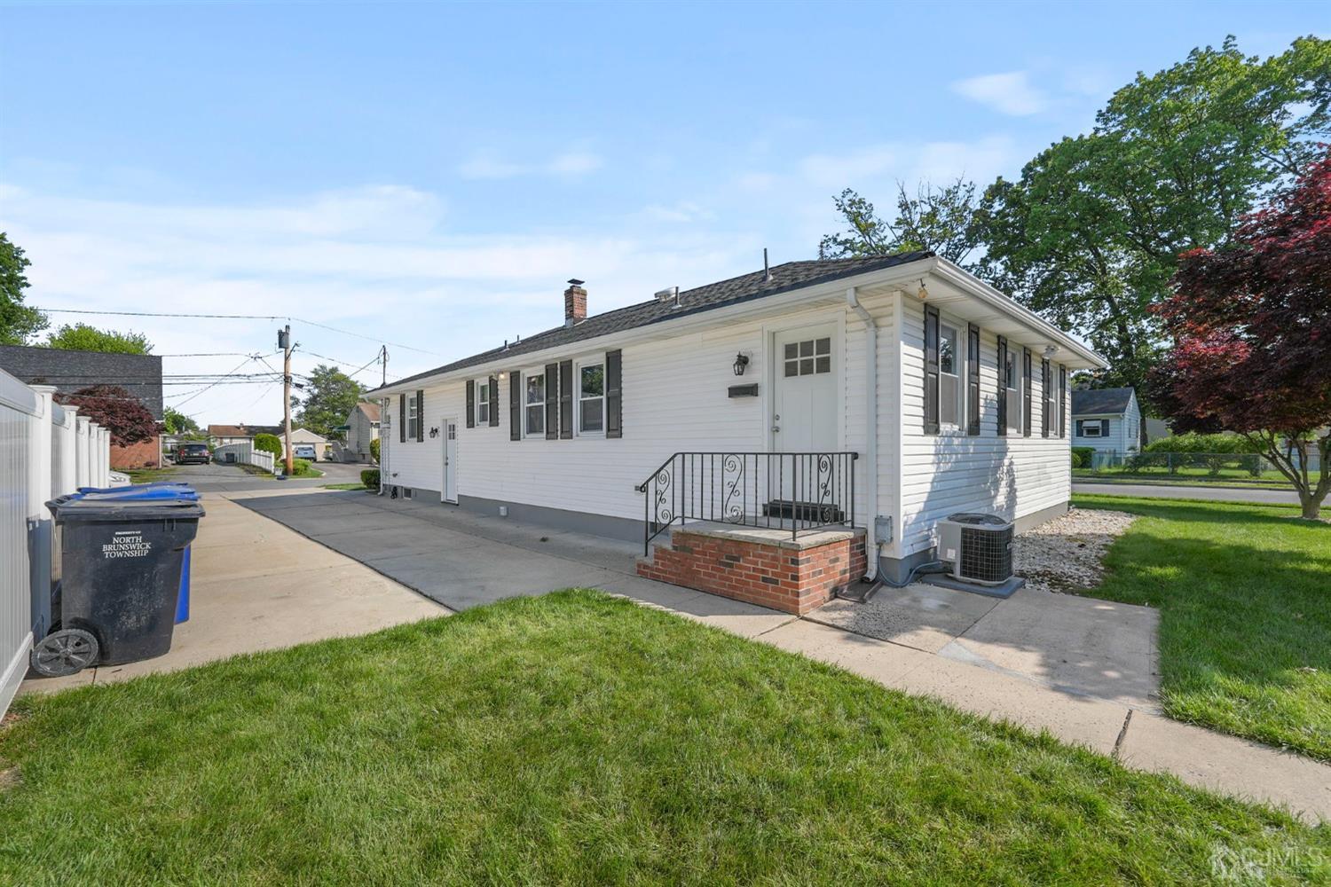 1067 Riverton Street North Brunswick, NJ 08902 - Photo 23 of 45 a front view of a house with garden