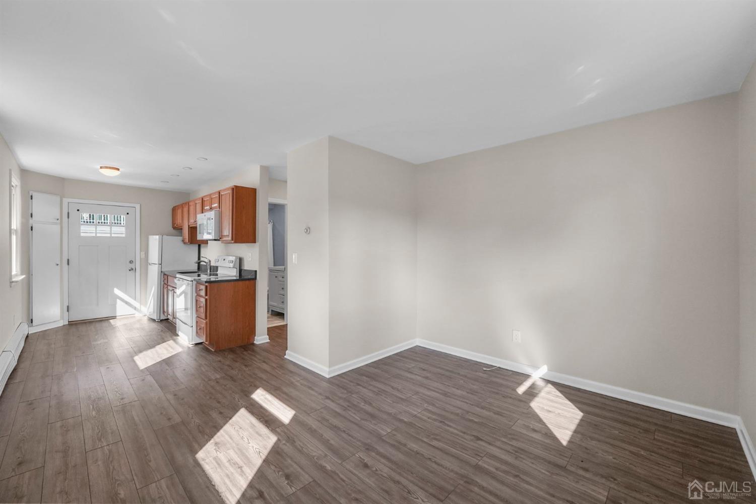 1067 Riverton Street North Brunswick, NJ 08902 - Photo 27 of 45 a view of kitchen with furniture and wooden floor