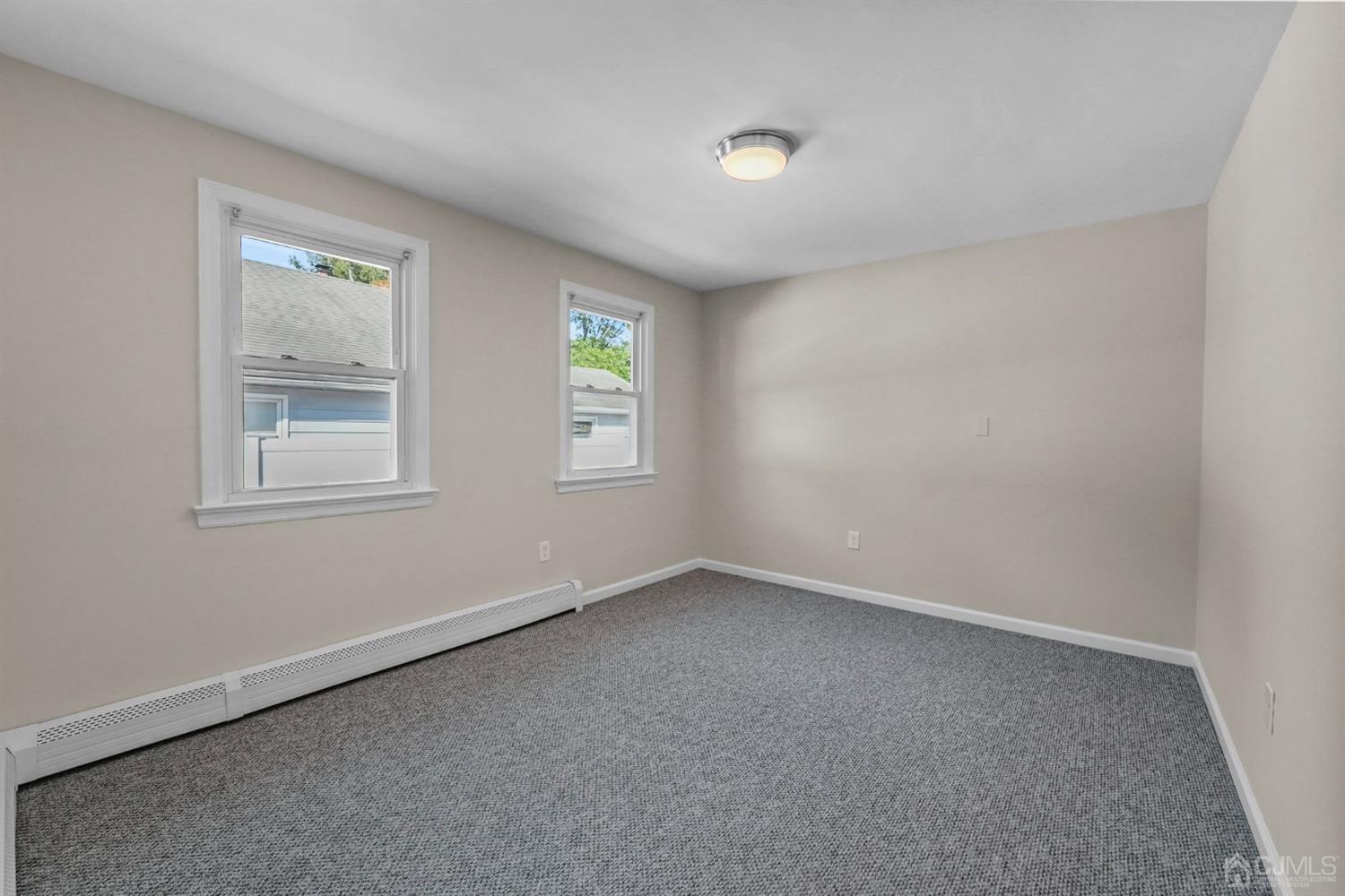 1067 Riverton Street North Brunswick, NJ 08902 - Photo 33 of 45 an empty room with windows