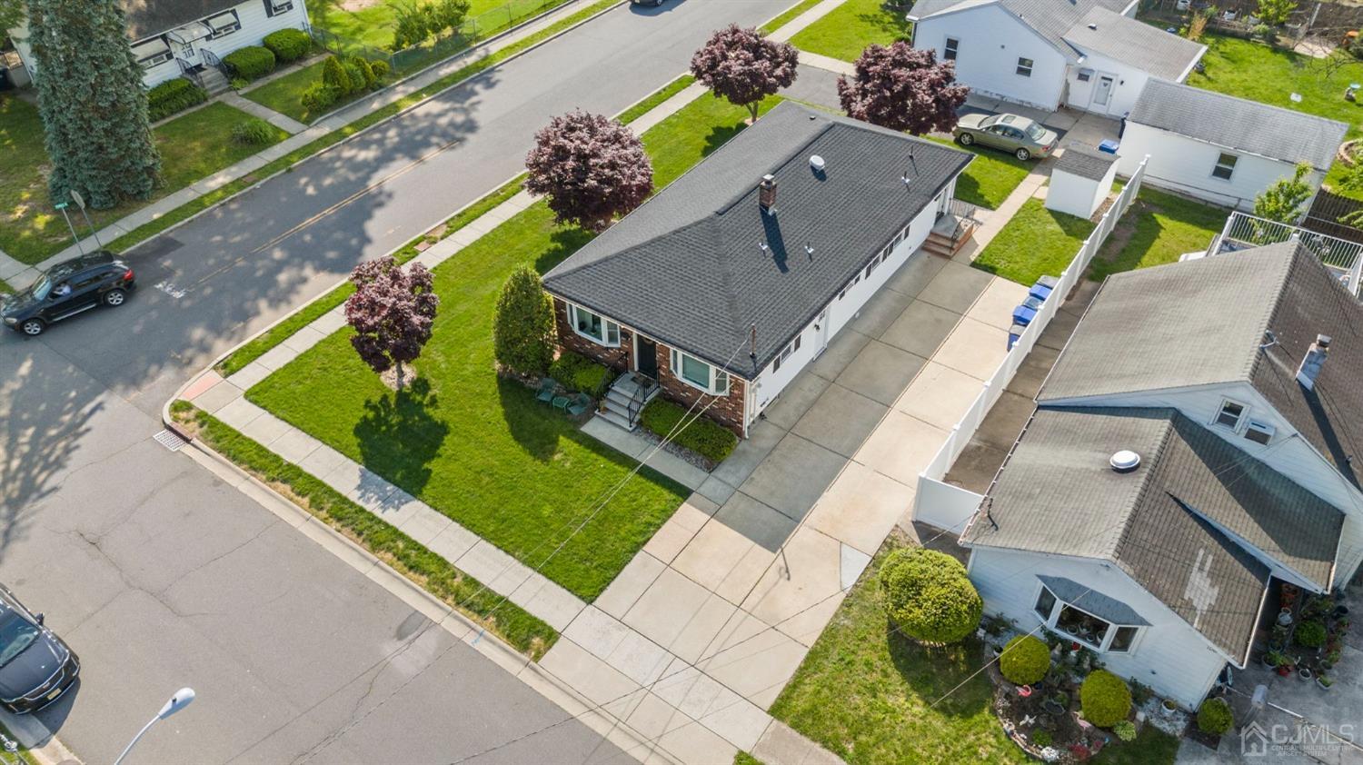 1067 Riverton Street North Brunswick, NJ 08902 - Photo 42 of 45 an aerial view of a house with a garden and swimming pool