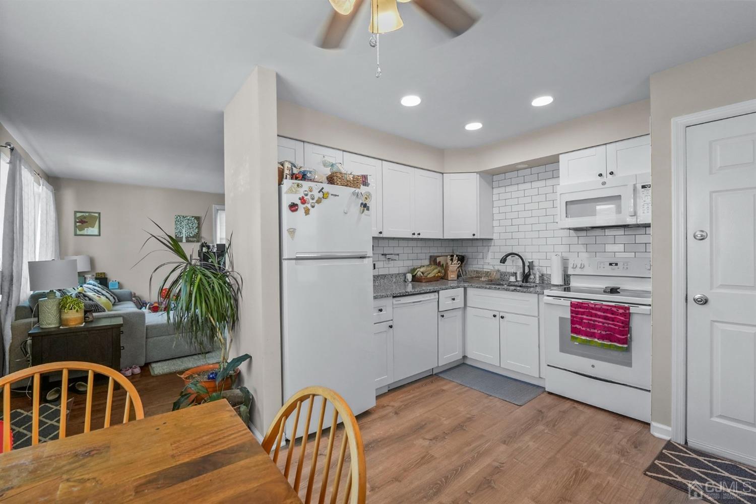 1067 Riverton Street North Brunswick, NJ 08902 - Photo 8 of 45 a kitchen with a refrigerator and a sink