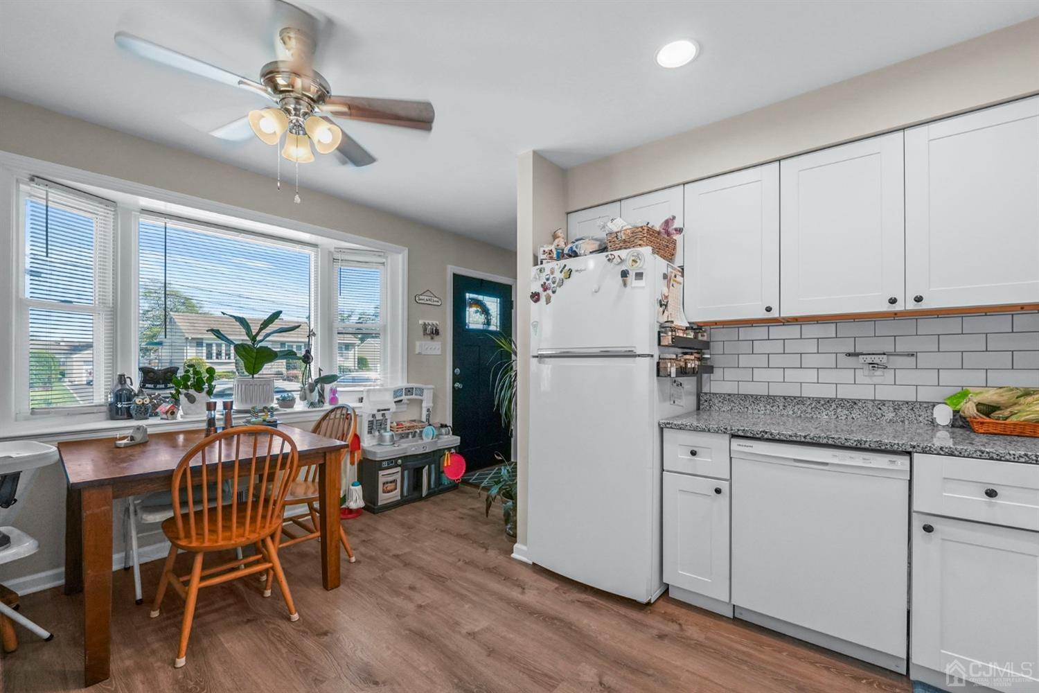 1067 Riverton Street North Brunswick, NJ 08902 - Photo 10 of 45 a kitchen with refrigerator cabinets and wooden floor