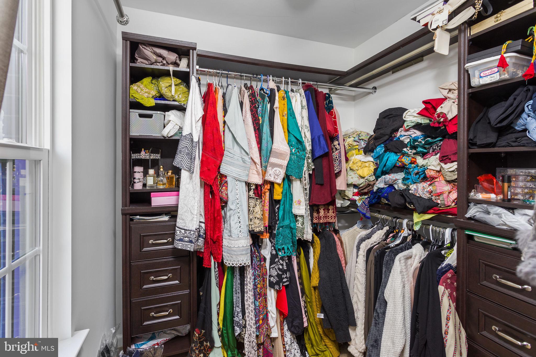 21 Sundance Drive Hamilton, NJ 08619 - Photo 22 of 29 a view of walk in closet with clothes