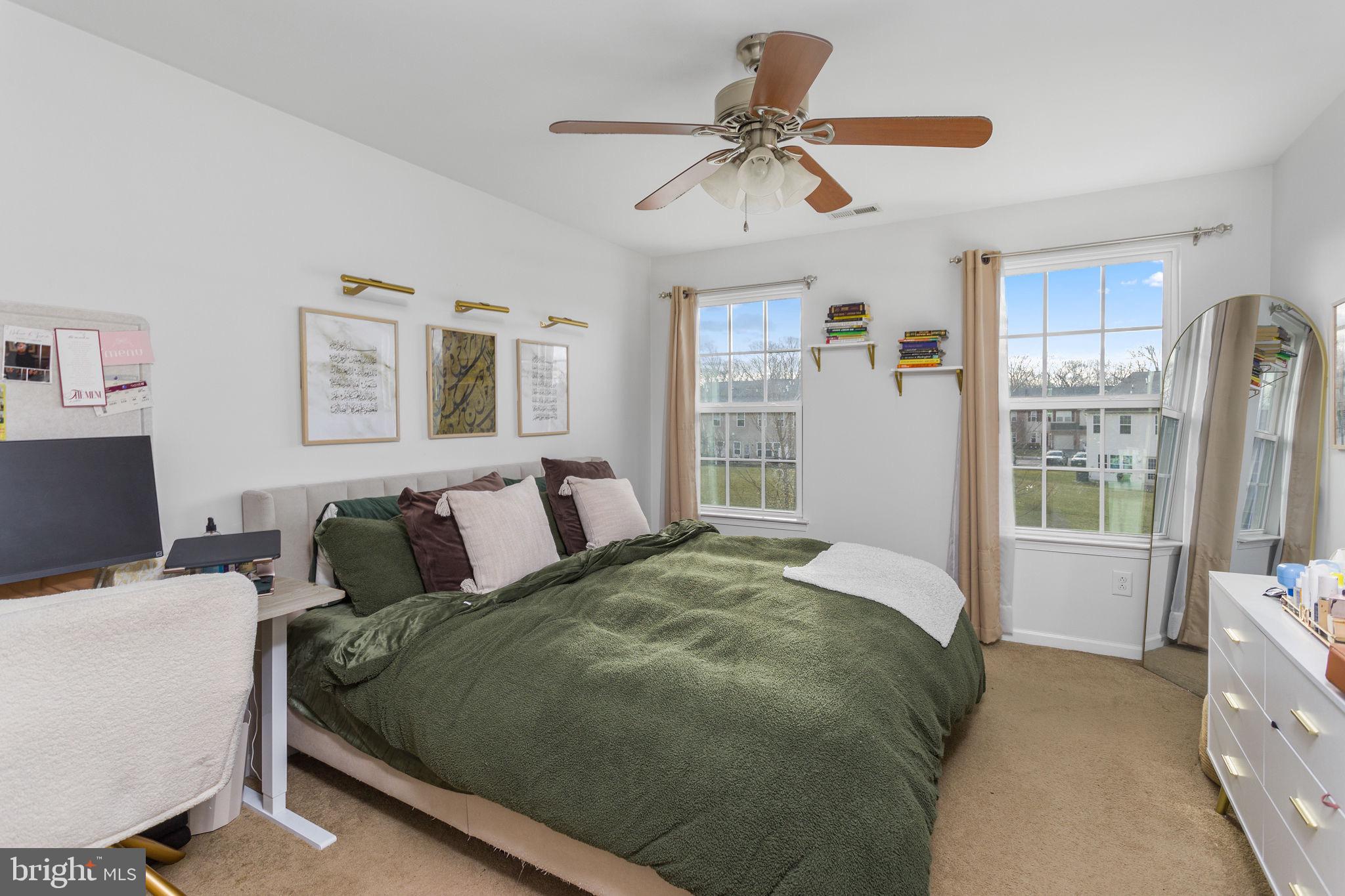 21 Sundance Drive Hamilton, NJ 08619 - Photo 23 of 29 a bedroom with a bed a couch and a window