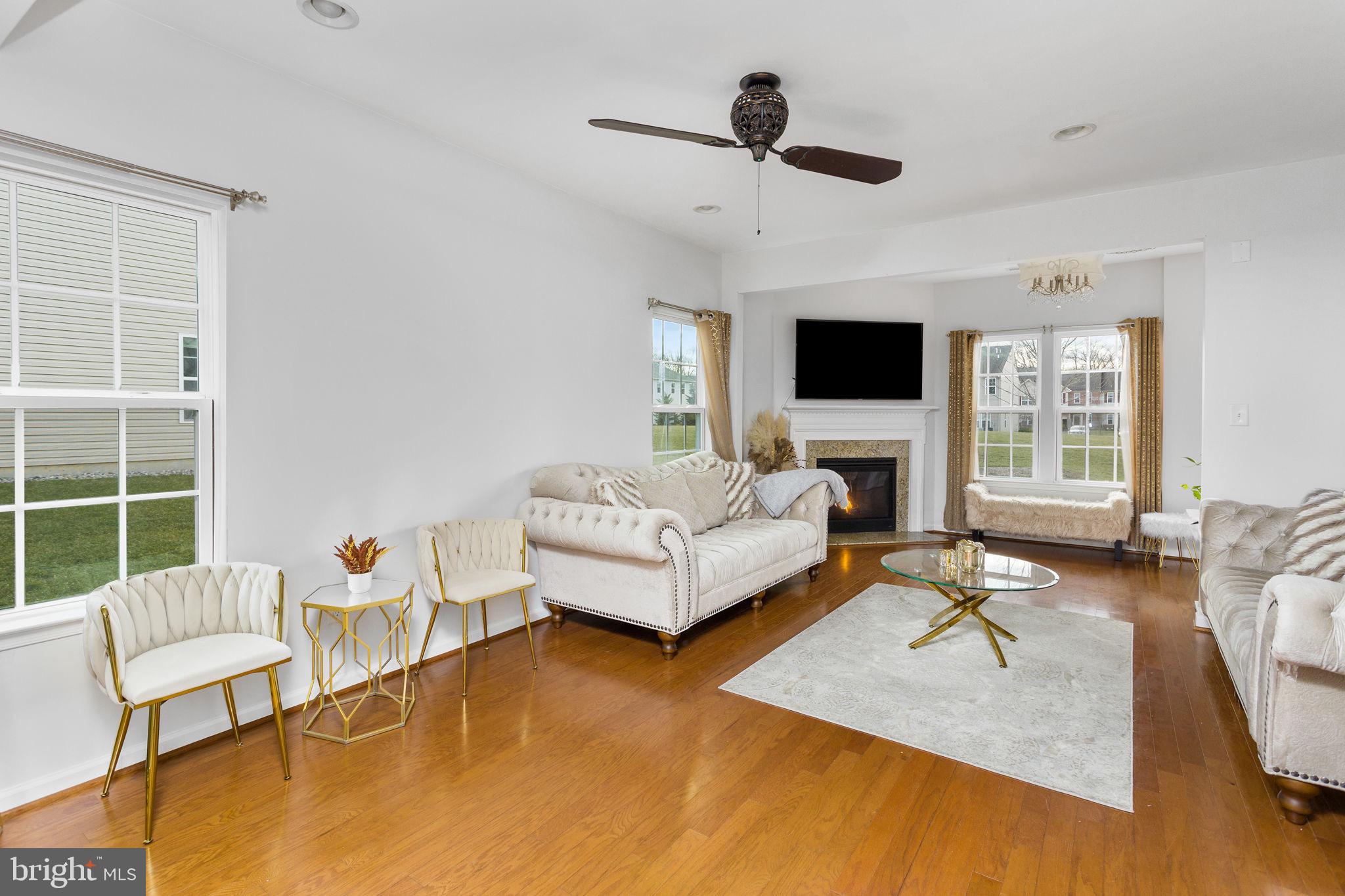 21 Sundance Drive Hamilton, NJ 08619 - Photo 5 of 29 a living room with furniture and a flat screen tv