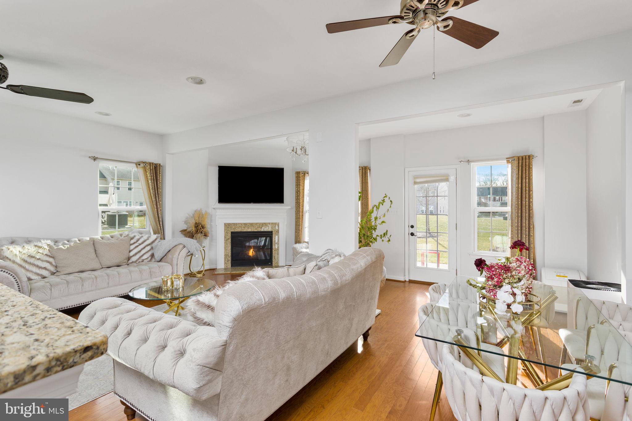 21 Sundance Drive Hamilton, NJ 08619 - Photo 6 of 29 a living room with furniture and a fireplace
