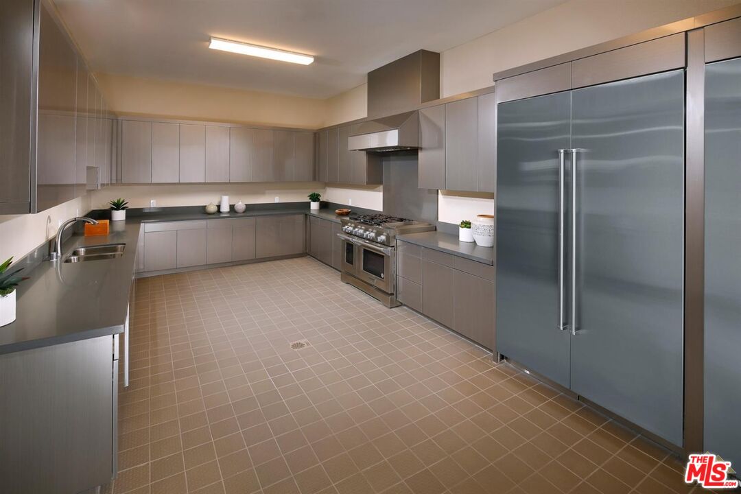 3709 Parterre Court Bakersfield, CA 93311 - Photo 13 of 30 a large kitchen with stainless steel appliances a refrigerator and a stove top oven