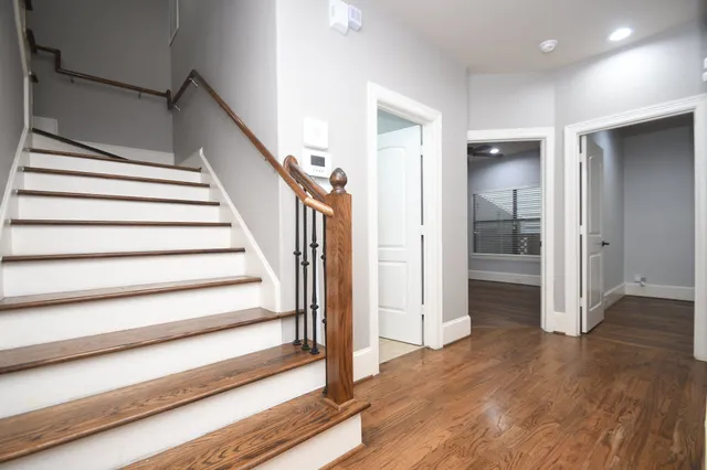 a view of entryway with wooden floor and stairs