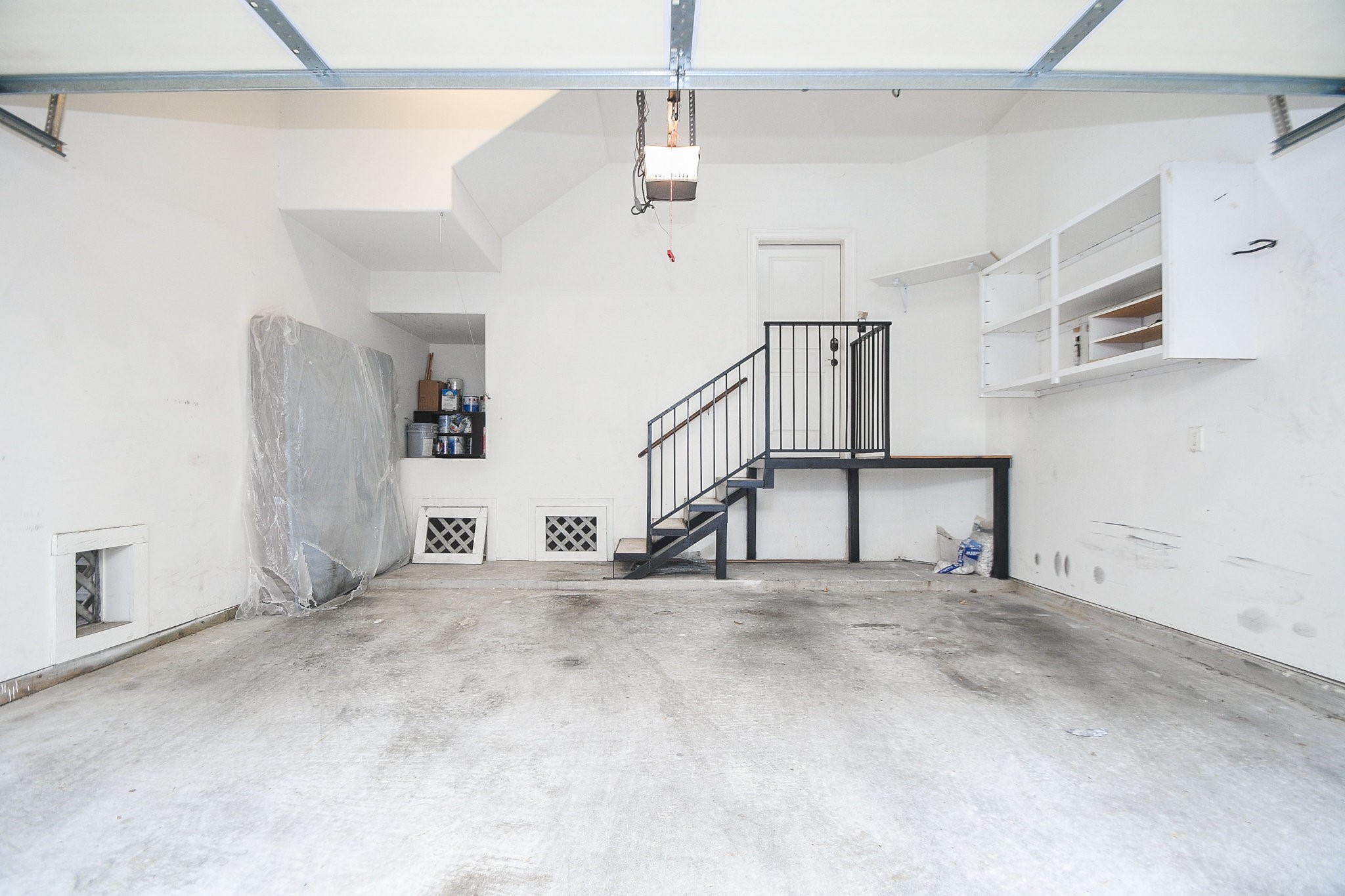 1222 West 17th Street, Unit D Houston, TX 77008 - Photo 31 of 35 a view of empty room with stairs and white walls