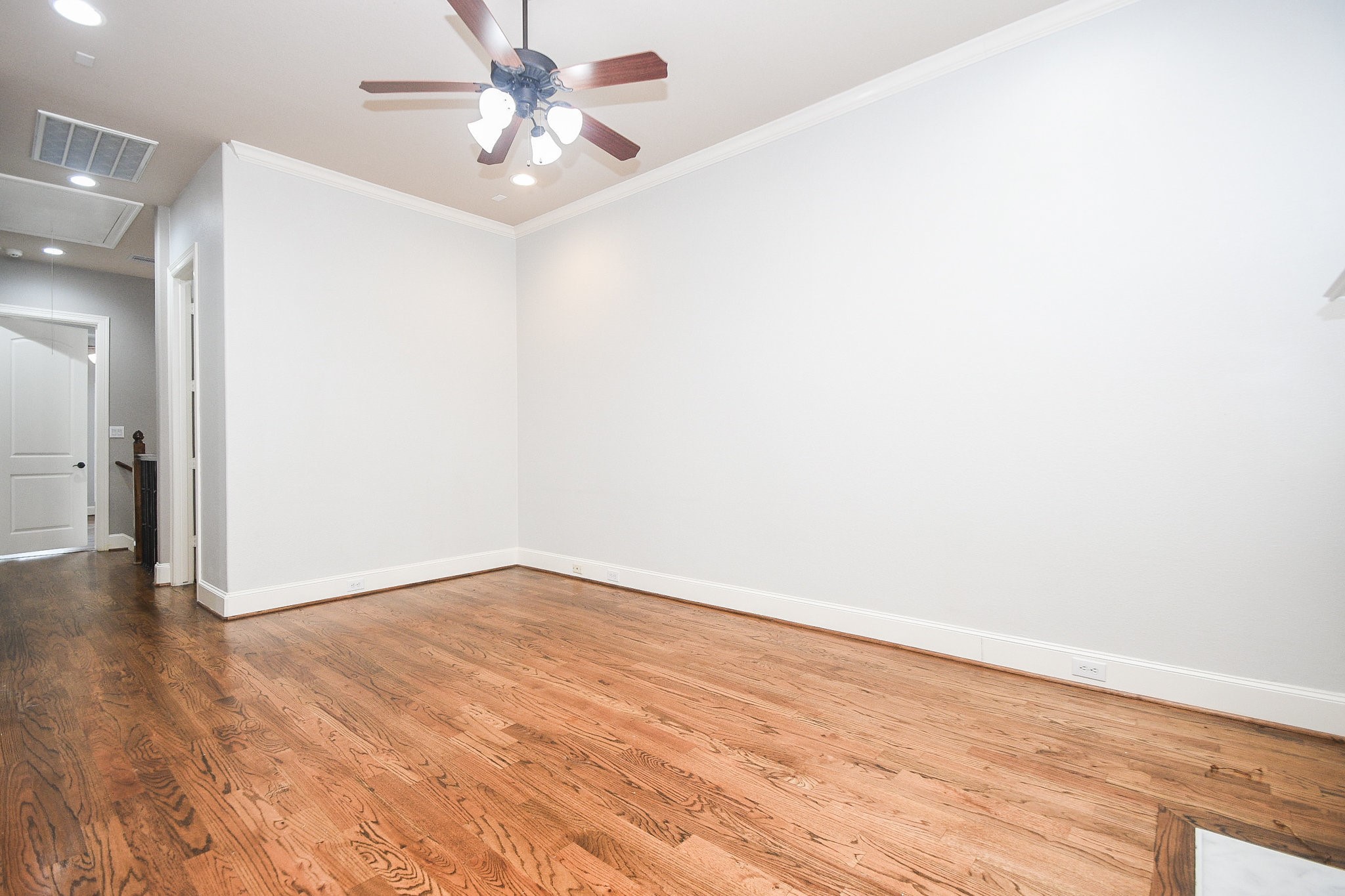 1222 West 17th Street, Unit D Houston, TX 77008 - Photo 5 of 35 a view of an empty room with wooden floor