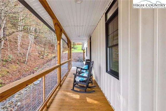 a view of a balcony with chairs