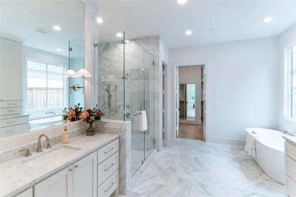 a bathroom with a double vanity sink mirror and double