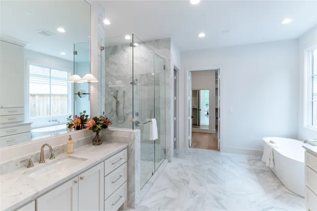 a bathroom with a double vanity sink mirror and double
