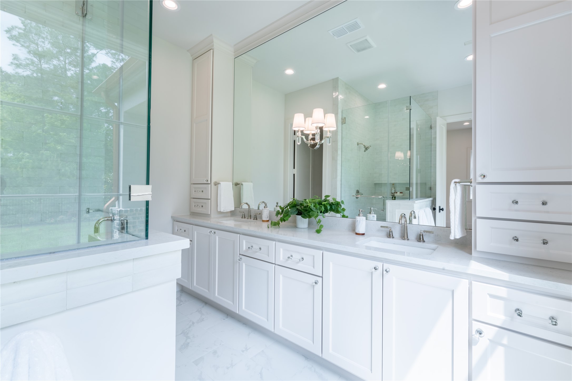 24710 Lake Kent Lane Spring, TX 77389 - Photo 18 of 33 a bathroom with a sink vanity granite tub and a mirror