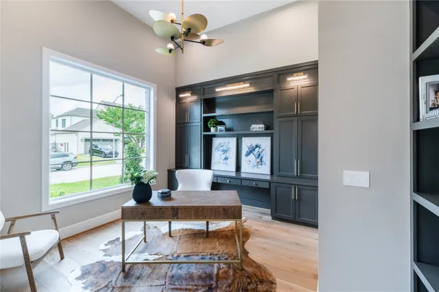 a living room with furniture a window and a table